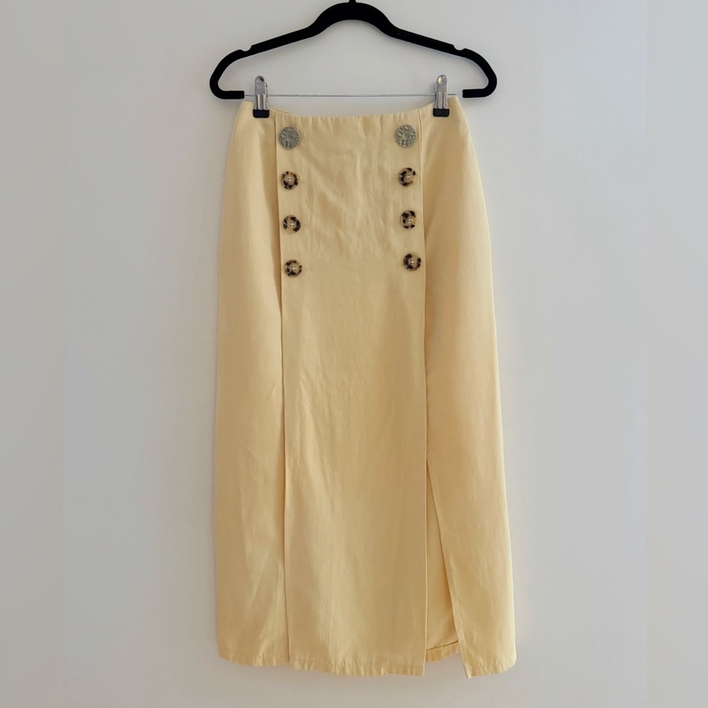 Pencil skirt w/ dbl breasted button detail & two slits.